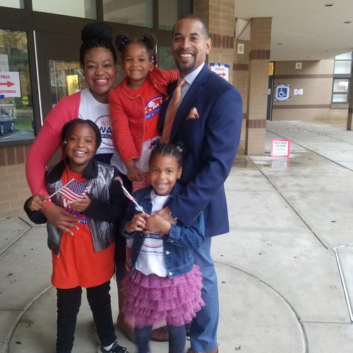 Michele Jawando with her husband, Will Jawando, and three children.