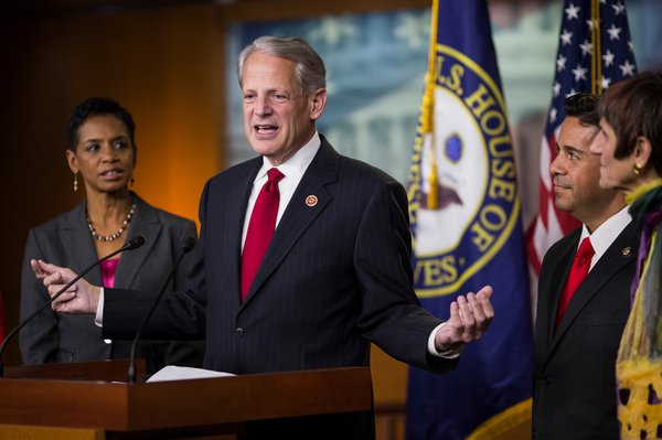 Congressman Steve Israel addresses a room in front of colleagues and staffers.